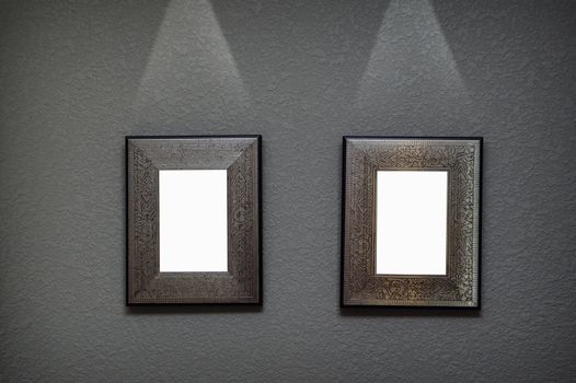 two metal frame on the wall with lighting
