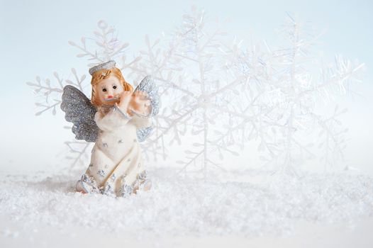 Christmas angel on silver background 