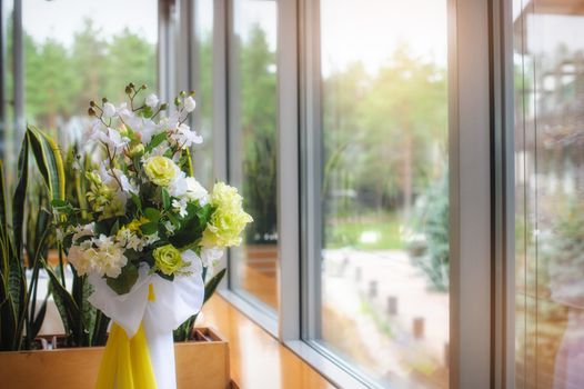 Arrangement of flowers in the window