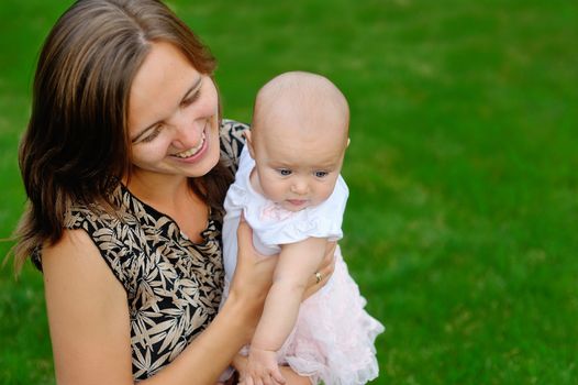 Mother and baby in park portrait 