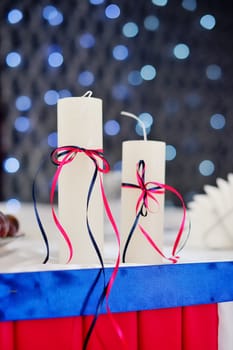 adorned decor with two candles on the background bokeh