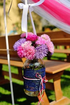 decor jar with flowers outdoors