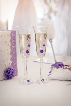 Two wedding glasses with champagne