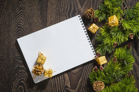 sheet of vintage paper with Santa's hat on wooden background 