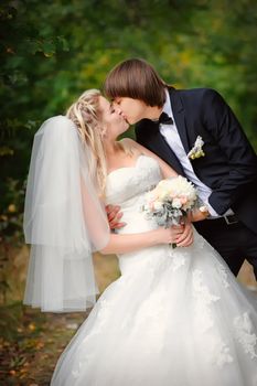 bride and groom outdoors park closeup portrait 