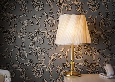Vintage glowing lamp in the room