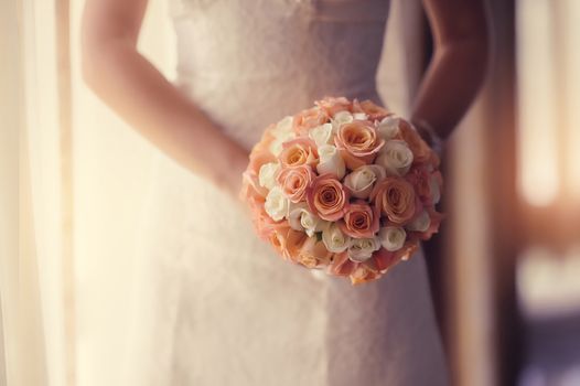 wedding bouquet at bride's hands. studio shot 