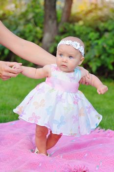 baby girl outdoors in a dress