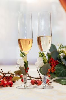 Two empty wedding champagne glasses on a table 