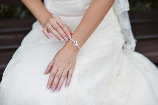 Wedding gloves on hands of bride, close-up 