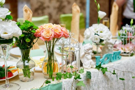 wedding table decorated with flowers and serving in the restaurant.