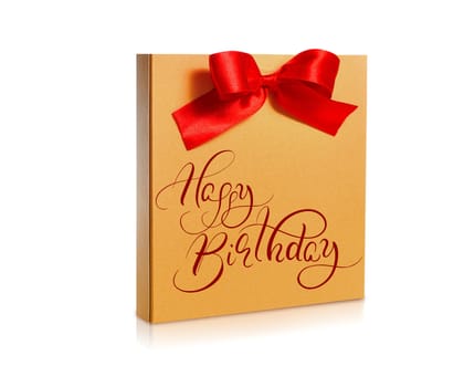 festive gold box with a red bow on a white background and text Happy Birthday. Calligraphy lettering.