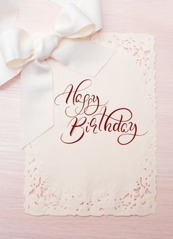 Background Holiday card with text Happy Birthday. Calligraphy lettering.