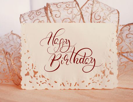 Background Holiday card with text Happy Birthday. Calligraphy lettering.