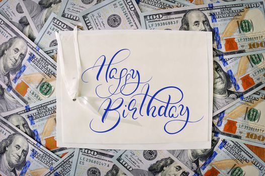 big pile of money. stack of american dollars backgrounds with text Happy Birthday. Calligraphy lettering.