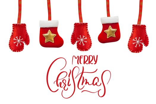 toy red boots and gloves isolated on a white background with text Merry Christmas. Calligraphy lettering.
