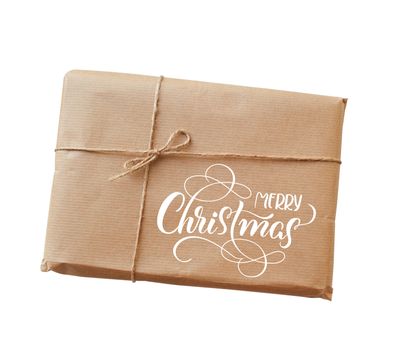 envelope kraft paper tied with string and text Merry Christmas. Calligraphy lettering.