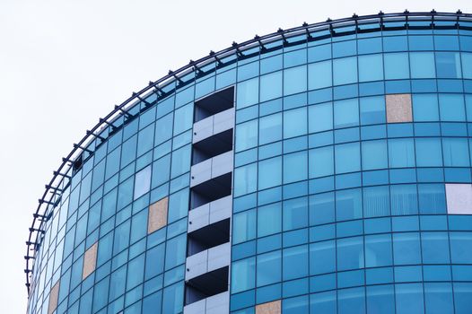 glass high-rise office building architecture on background of sky