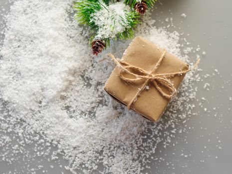 gift boxes of kraft paper with spruce branches on white background