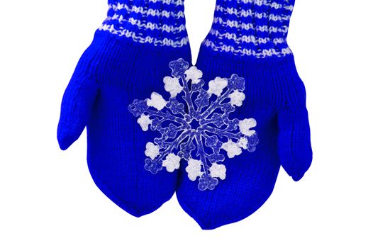 Christmas concept blue mittens with toy snowflake on a white background.