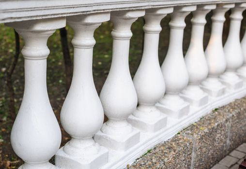 white balusters made of cement, architectural element.