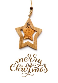 Wooden Toy star on a white background and text Merry Christmas. Calligraphy lettering.