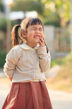 face of asian children show toothy face funny emotion