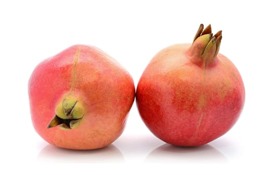 Fresh Indian pomegranate on a white background