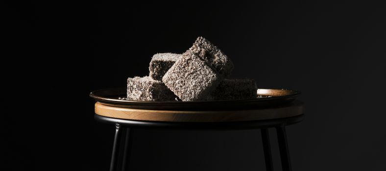 Group of Lamingtons on a metal baking tray