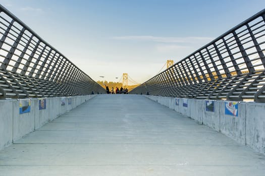 San Francisco, CA, USA, october 22, 2016; the pedestrian way on pier 14 with saegulls and bay bridge on the background