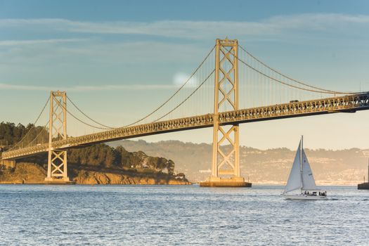 Bay bridge at sunset in a warm autumnal day