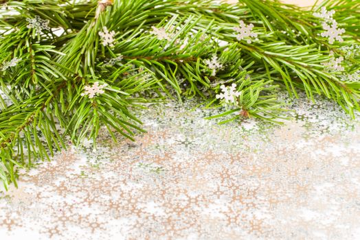 fir tree branch and snow flares confetti with copy space. Merry Christmas and New Year concept