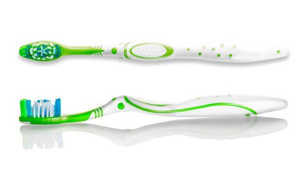 two toothbrushes closeup on against white background