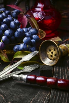 Hookah ,grapes and Arabic stylish lantern with candle
