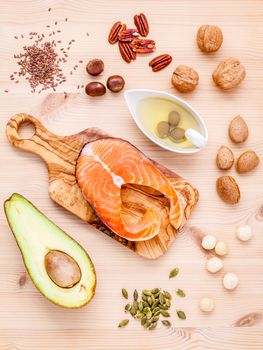 Selection food sources of omega 3 and unsaturated fats. Super food high omega 3 and unsaturated fats for healthy food. Almond ,pecan ,hazelnuts,walnuts ,olive oil ,fish oil ,salmon and avocado .