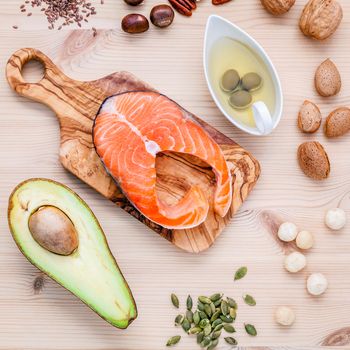 Selection food sources of omega 3 and unsaturated fats. Super food high omega 3 and unsaturated fats for healthy food. Almond ,pecan ,hazelnuts,walnuts ,olive oil ,fish oil ,salmon and avocado .