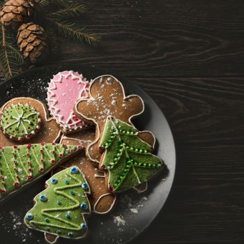 New year homemade gingerbreads on wooden background. Christmas theme.