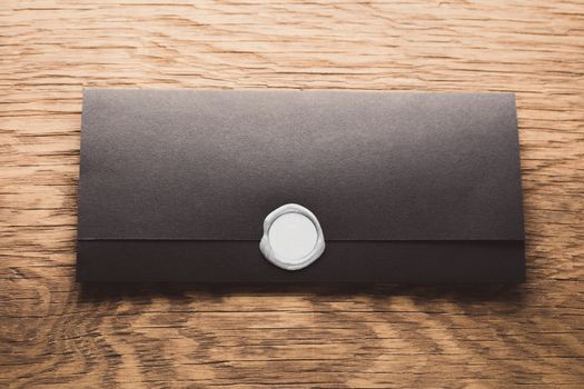 envelope with stamp on the wooden table