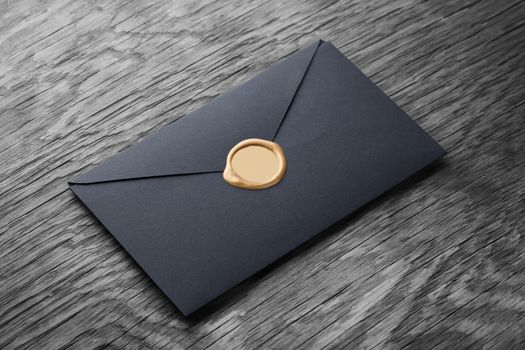 envelope with stamp on the wooden table