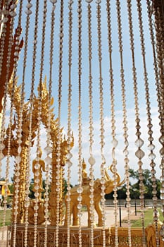 View through the crystal bead behind a curtain is buddha statue and blue sky







View through the crystal bead behind a curtain is buddha statue and blue sky