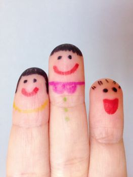 Happy family concept : Finger puppets of loving mother and father with young child
