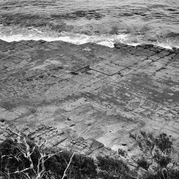 View of Tessellated Pavement in Pirates Bay, Tasmania. Black and White.