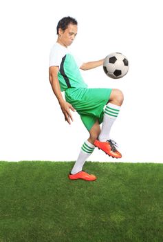 portrait of football ,soccer players playing soccer ball on green grass field isolated white background use for team sport and athletics theme 