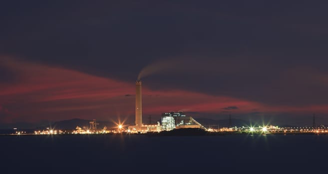 heavy industry in industrial estate and beautiful dramatic sky twilight of a day use for industry and green environment