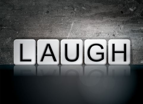 The word "Laugh" written in white tiles against a dark vintage grunge background.