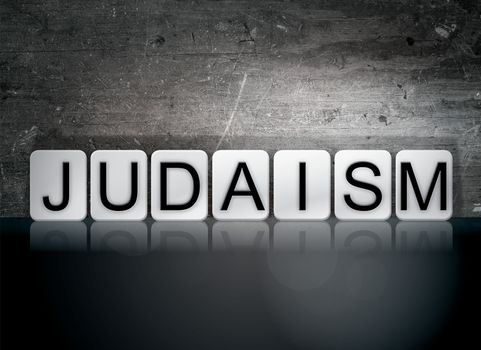 The word "Judaism" written in white tiles against a dark vintage grunge background.