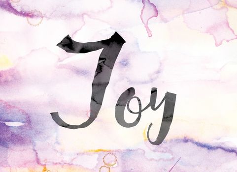 The word "Joy" painted in black ink over a colorful watercolor washed background concept and theme.