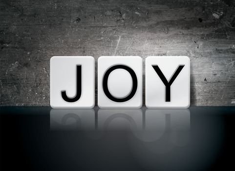 The word "Joy" written in white tiles against a dark vintage grunge background.
