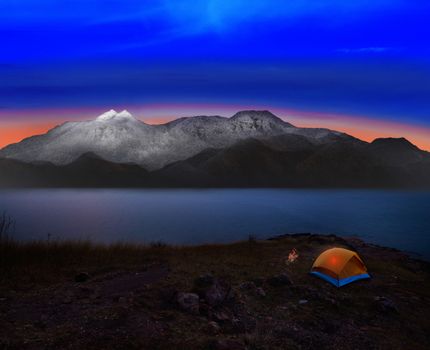 camping tent with rock and snow mountian scene use for natural adventure journey and heaven destination