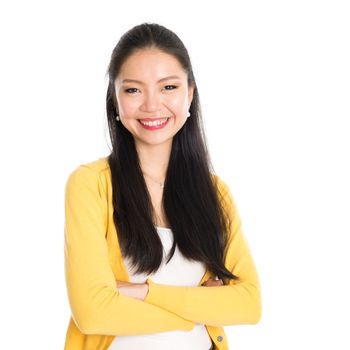 Portrait of Asian female, smiling looking at camera, standing isolated on white background.